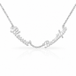 A silver script affirmation nameplate necklace reading 'Blessed Beautiful' on a delicate chain, shown against a clean white background with a soft reflection below.