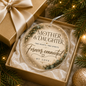 A round clear acrylic Christmas ornament with gold and black lettering that reads 'MOTHER & DAUGHTER', 'Two hearts. Two spirits.