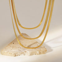 Load image into Gallery viewer, For Her Triple-Tiered Snake Chain Necklace for a Fashionable Layered Look-with background
